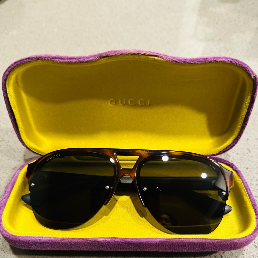 Gucci sunglasses with blue & red stripes on the side